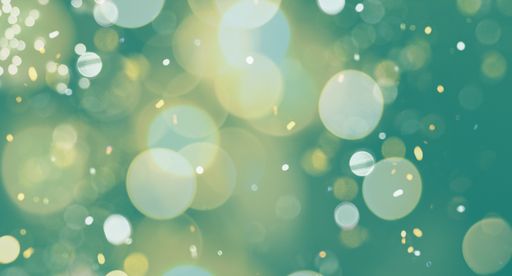 An abstract golden bokeh lights on a turquoise background
