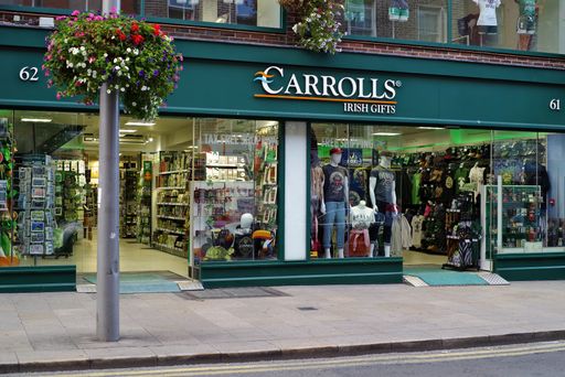 Street view of the entrance to the Carrolls Irish Gifts chain store in Dublin city center. Evening time, just before closing of the store.