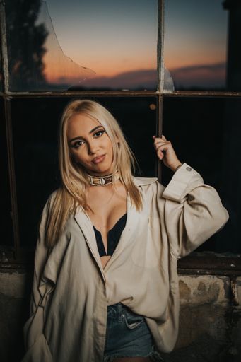 A sexy fashionable Bosnian Caucasian woman posing in an abandoned building