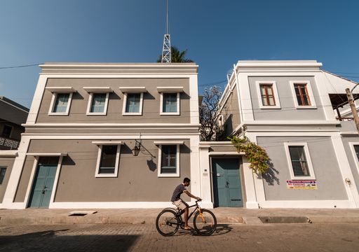 Pondicherry. India - February 2020: Old French architecture with grey walls and rectangular windows in the streets of Pondicherry.