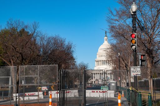 The Capitol Building surrounded by fences and razor wire