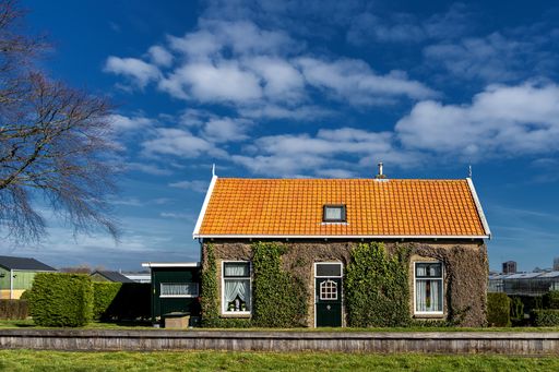 A tiny house on the dike in Holland near Delft, The Netherlands