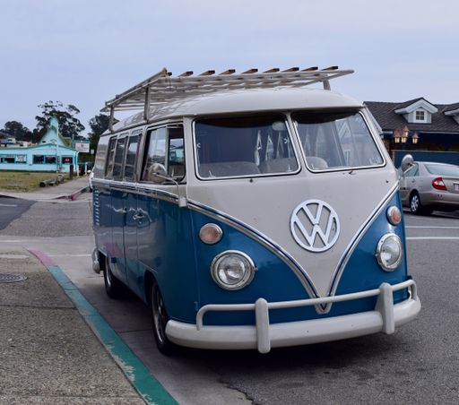 A front view photo of a beautiful vintage blue and white VW Bus /Wagon parked in town at Morro Bay in Ca. 2021