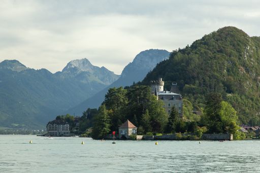 A long shot of Chateau de Duingt by the shore of Lake Annecy in France