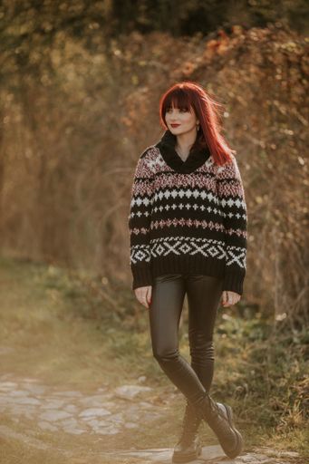 A red hair Caucasian female from Bosnia and Herzegovina standing and looking around