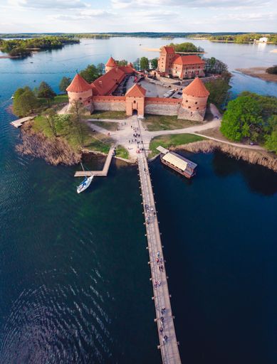 A vertical shot of a bridge leading to a Trakai Castle in Lithuania