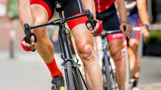detail of bike and feet of a cyclist in a bicycle race