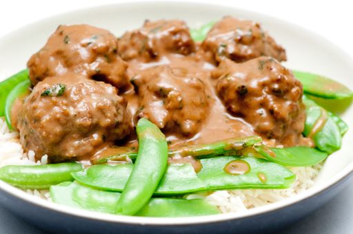 honey garlic meatballs with white rice and snap peas with a nice sauce
