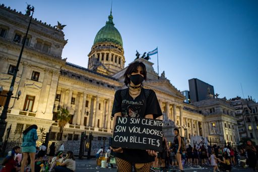 Woman holding a protest poster on International march for women's day in Buenos Aires, Argentina