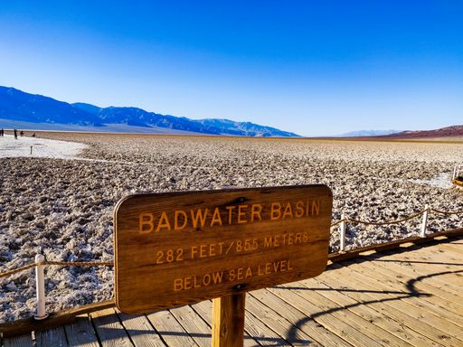A closeup of a wooden signboard "Badwater Basin" in Death Valley, USA