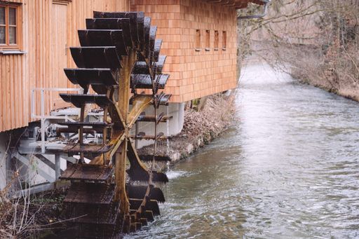 An old functional watermill on a river