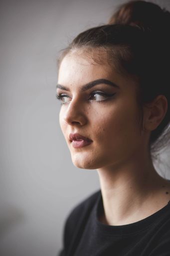 A young Bosnian woman with a bun hairstyle