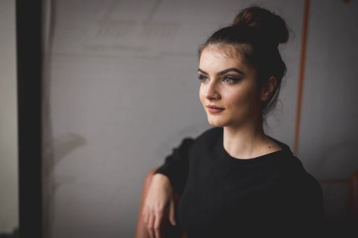 A young Bosnian woman with a bun hairstyle