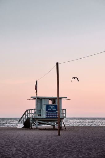 A vertical shot of a baywatch house on beautiful sunset background, Santa Monica, California