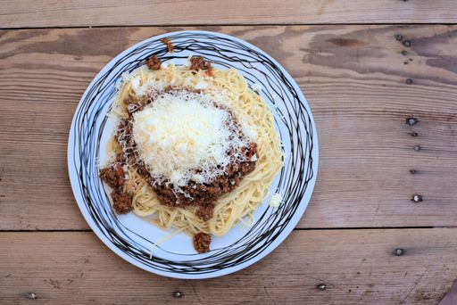 A closeup shot of a plate of spaghetti bolognese