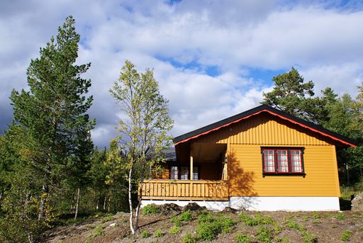 A typical Norwegian rural cottage with breathtaking landscape and beautiful greenery in Norway