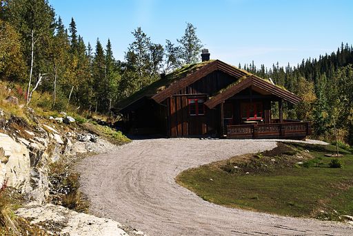 A typical Norwegian rural cottage with breathtaking landscape and beautiful greenery in Norway