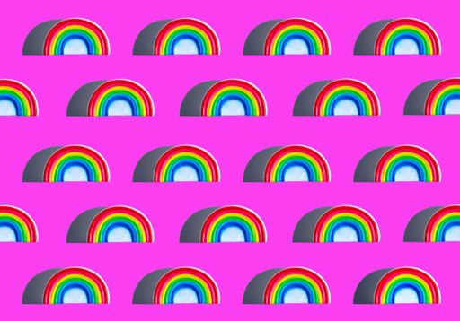 A seamless rainbow patterns with shadows on a pink background