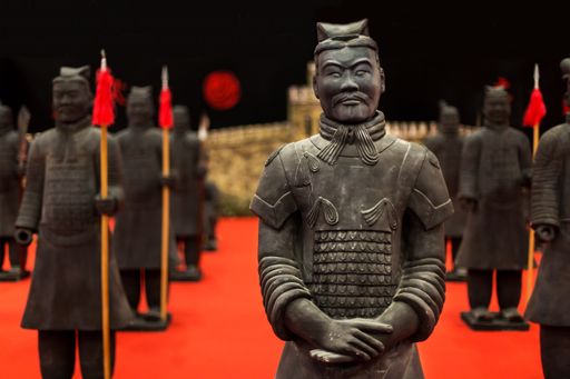 A closeup of the duplicates of the Chinese Terracotta Army with a blurry background