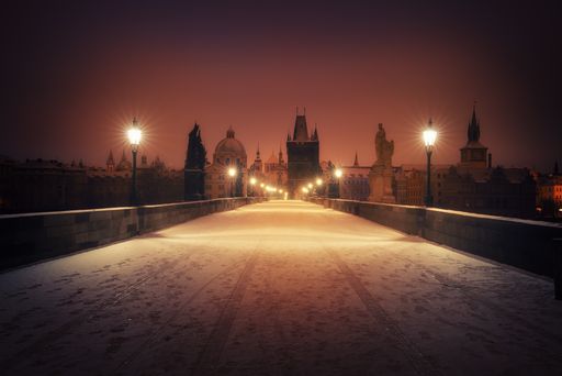 A beautiful night shot from the medieval stone arch Charles Bridge in Prague