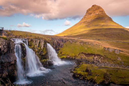 Beautiful photo of Kirkjufell volcano and its waterfall during the morning, in the East of Iceland.