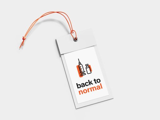 A closeup shot of a paper clothing tag with "back to normal" writing