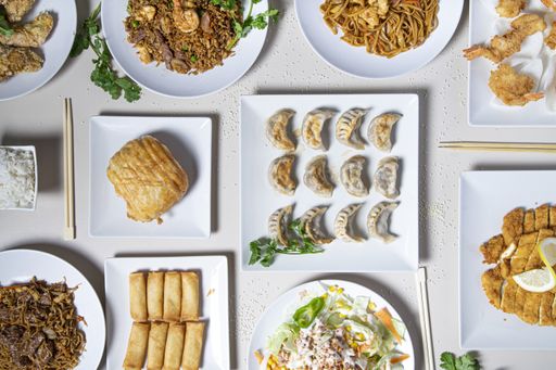 A top view of traditional Chinese food on a restaurant table