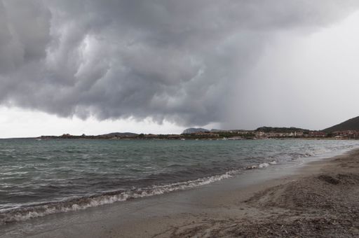 A view of storm clouds on the beach in Golfo Marinella Sardinia, Italy