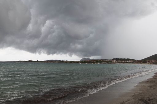 A view of storm clouds on the beach in Golfo Marinella Sardinia, Italy