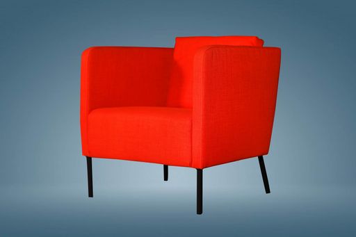 red color armchair. Modern designer chair on white background. Textile chair. chair used in guest room.