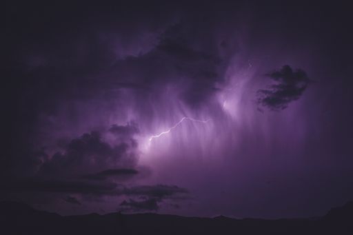 A flash of beautiful purple lightning on the sky