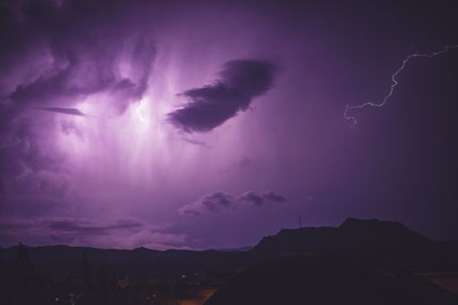 A flash of beautiful purple lightning on the sky