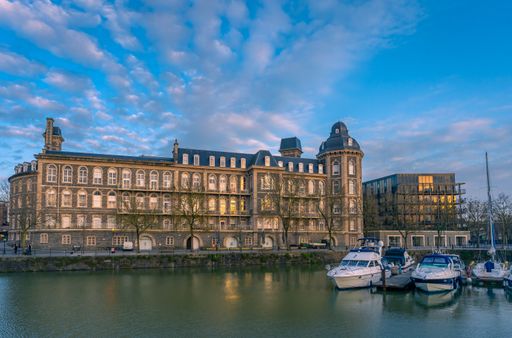 Bristol General Hospital and a selection of boats under a blue cloudy sky