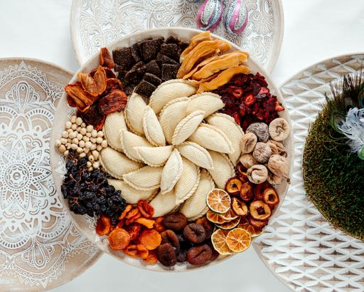 An overhead shot of delicious sweets in a decoration set for the Novruz Holiday