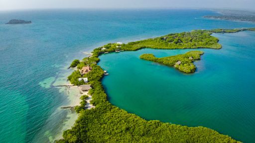 Nice sunny day of aerial shot of nice green islands in cartagena with crystal clear waters