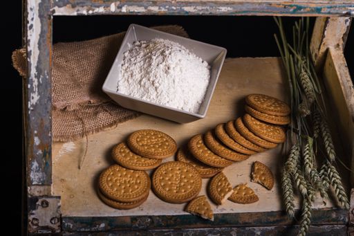 A closeup shot of tasty cookies on a rusty surface on a black background