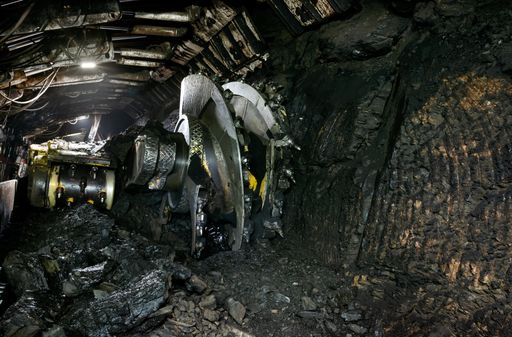 Longwall Mining: Shearer, with two rotating cutting drums and movable hydraulic powered roof supports called shields