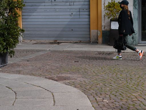 Lombardy, Italy March 2021 few people , around closed shops because of covid19 lockdown as Lombardy entered red zone again