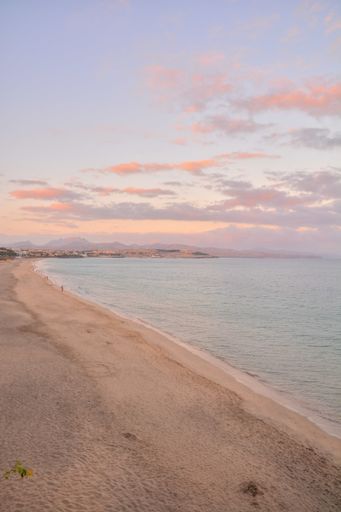 A vertical shot of sunset at the tropical volcanic Canary Islands in Spain