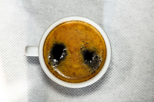 A top view of a cup of hot coffee