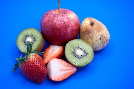 The organic fruits on a blue background