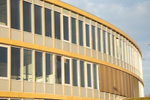 An oval patterned yellow building facade