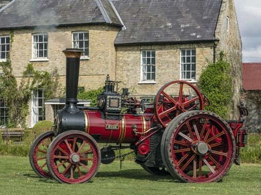 NORFOLK, UK - 04/28/2019: Steam Traction Engine  'Jessie' in front of farmhouse