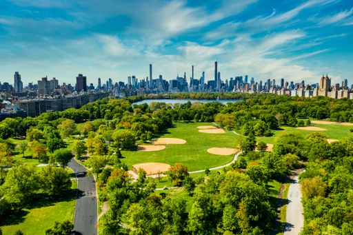 A Central Park in Manhattan, New York, a huge beautiful park surrounded by skyscraper
