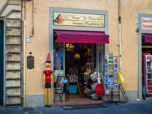 shopping street Corso Italia in the old town of Pisa with unidentified people. Pisa is known worldwide for its leaning tower