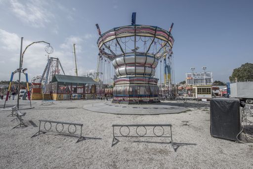 An amusement park closed, waiting for better times, with no people and no fun.