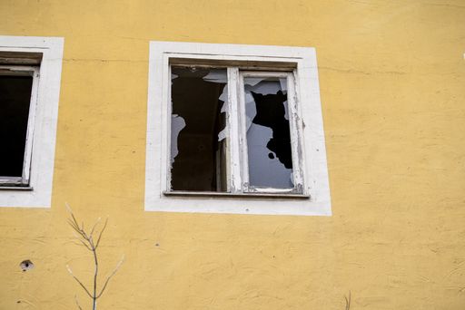 Broken smashed window glass of an abandoned building