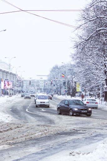 Radauti - Romania - 7th February 2020: Road with cars in the city during winter time