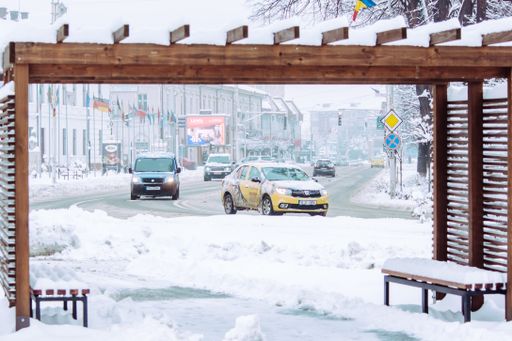 Radauti - Romania - 7th February 2020: Road with cars in the city during winter time