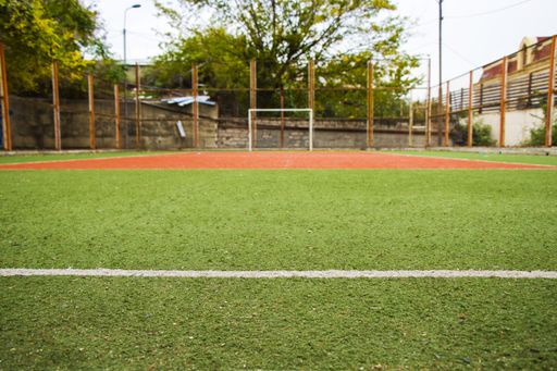 A scenic view at an empty soccer field on a sunny day